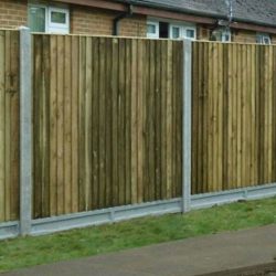 Featheredge panels with lightcast slotted concrete posts and gravel boards