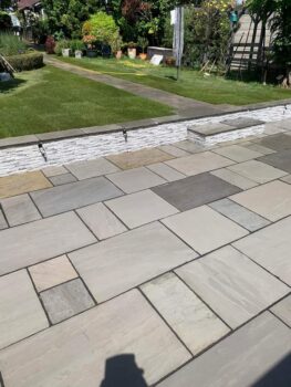 Mountain Ice cladding sunken patio area walls with lights to be added